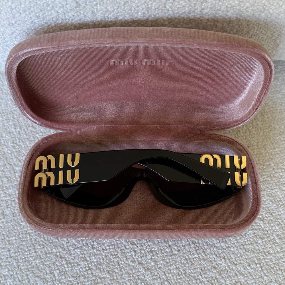 Miu Miu Black and Gold Sunglasses
